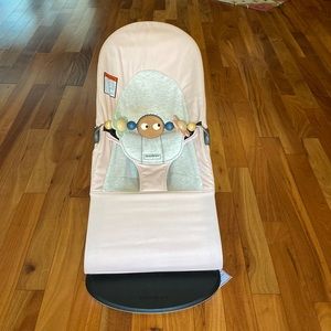 Pink baby bjorn bouncer with toy